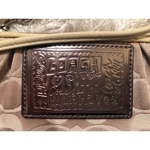 COACH gold and tan wristlet